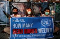 People attend prayer ceremony at U.N. building in Bangkok