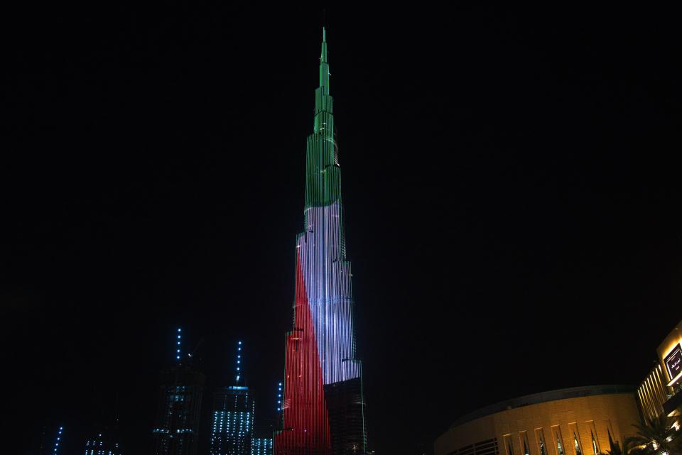 The Burj Khalifa, the world's tallest building, displays the Emirati flag as part of the "World's Tallest Donation Box" campaign in Dubai, United Arab Emirates, Monday, May 11, 2020. The campaign raised money for meals to the hungry amid the coronavirus pandemic. (AP Photo/Jon Gambrell)