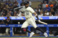 Minnesota Twins Willi Castro hits a sacrifice bunt against the Boston Red Sox during the seventh inning of a baseball game, Friday, May 3, 2024, in Minneapolis. (AP Photo/Matt Krohn)