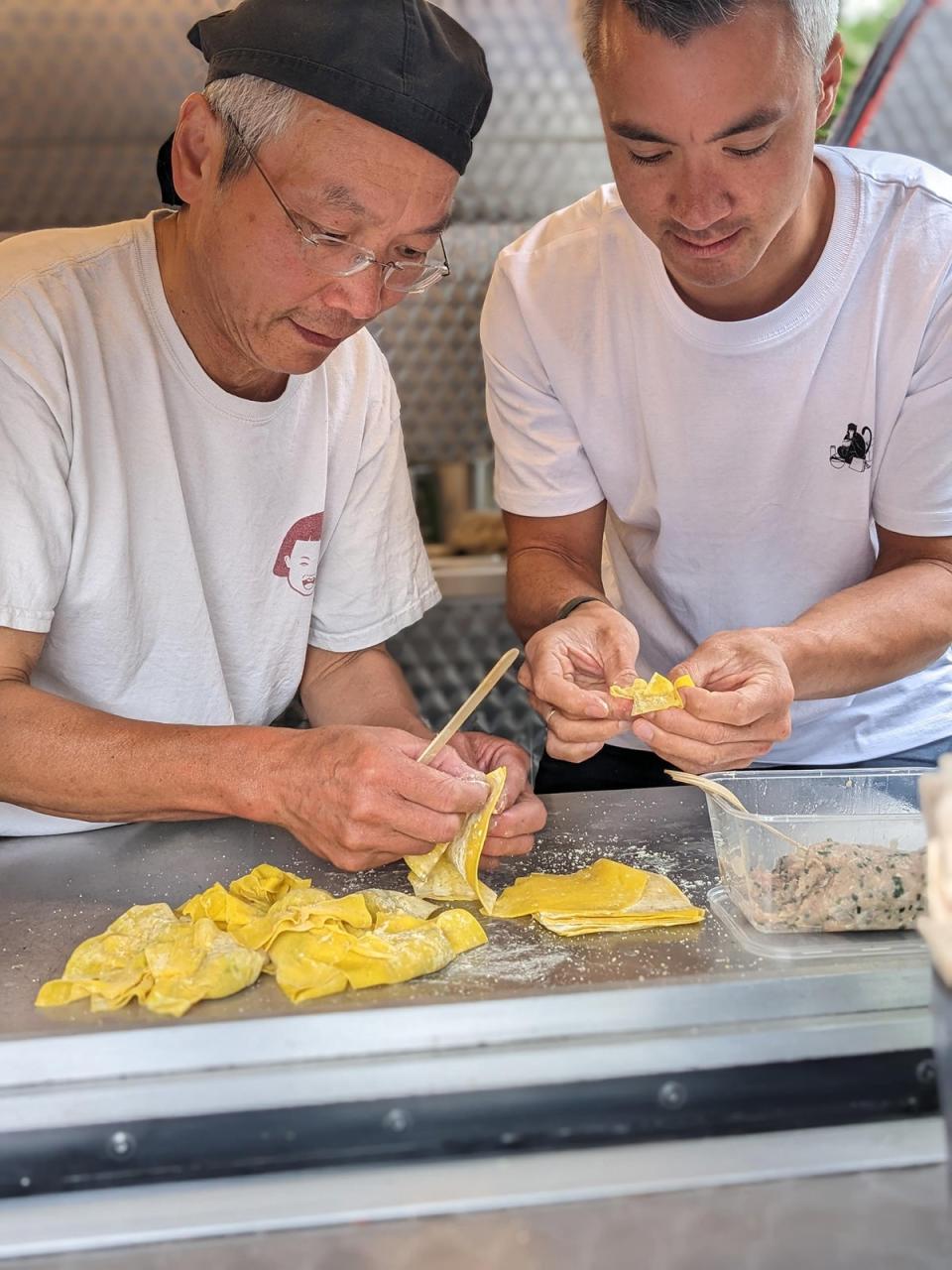 Yeung (R) and his father making wontons (Supplied)