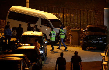 FILE PHOTO: Police arrive at former prime minister Najib Razak's residence in Kuala Lumpur, Malaysia May 16, 2018. REUTERS/Lai Seng Sin/File Photo