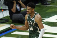 Milwaukee Bucks forward Giannis Antetokounmpo reacts to a basket against the Phoenix Suns during the first half of Game 3 of basketball's NBA Finals in Milwaukee, Sunday, July 11, 2021. Milwaukee won 120-100. (AP Photo/Paul Sancya)