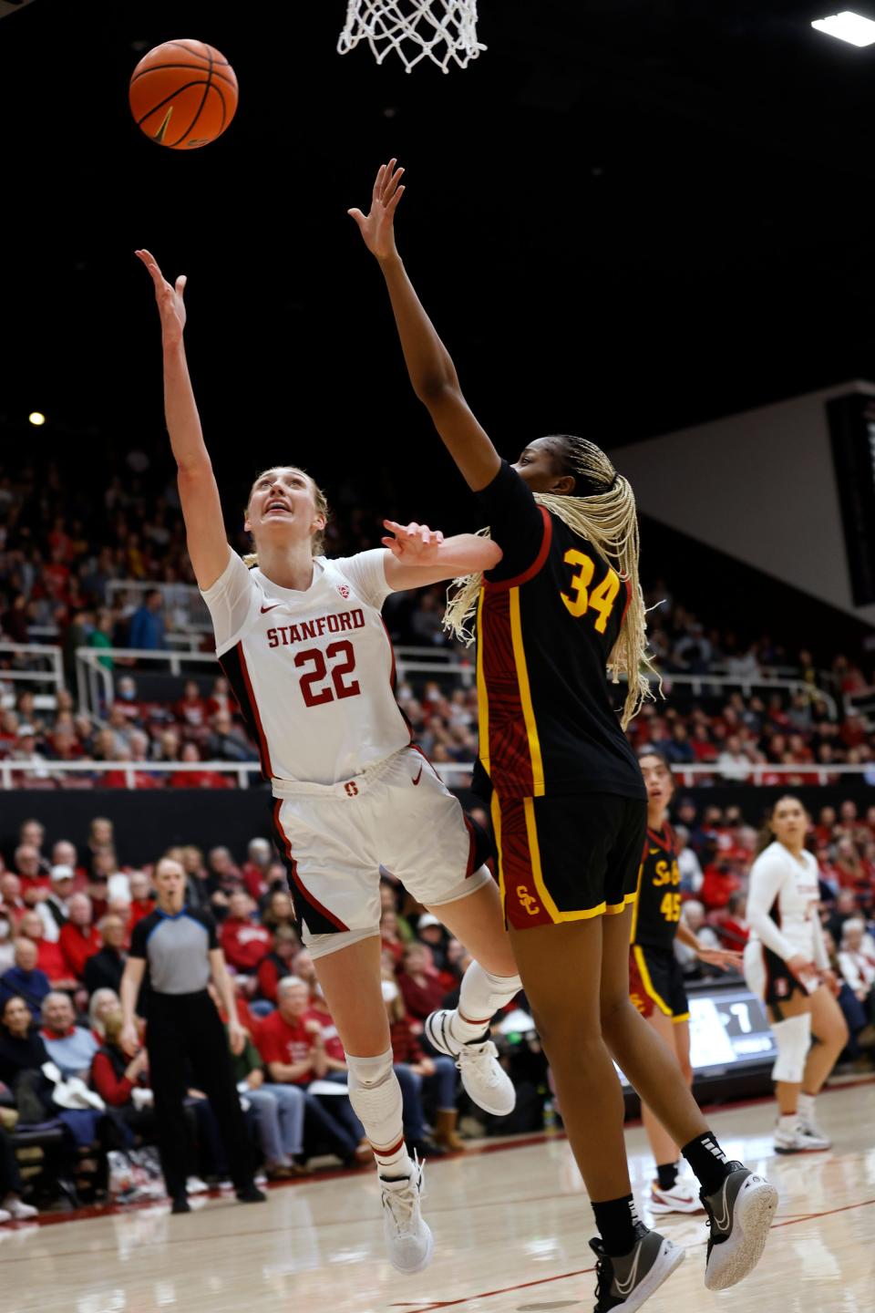 Stanford forward Cameron Brink (22) goes to the basket against Southern California center Clarice Akunwafo (34) in the first half of the game Friday, Feb. 2, 2024, in Stanford, California.