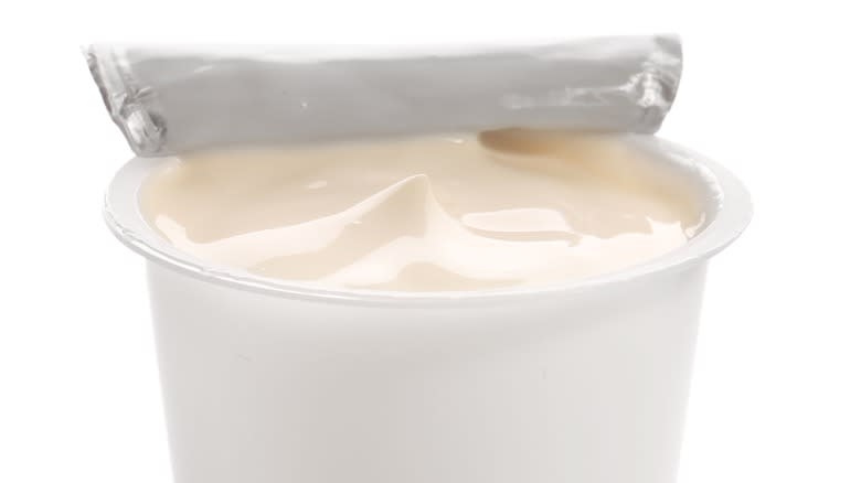 an open cup of yogurt