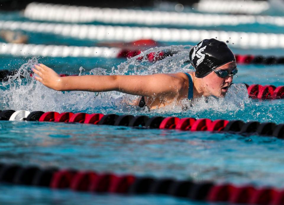 Palm Springs’ Kay Pivonka competes in the girls 100-yard butterfly during the DEL individual swim finals at La Quinta High School in La Quinta, Calif., Thursday, April 28, 2022.