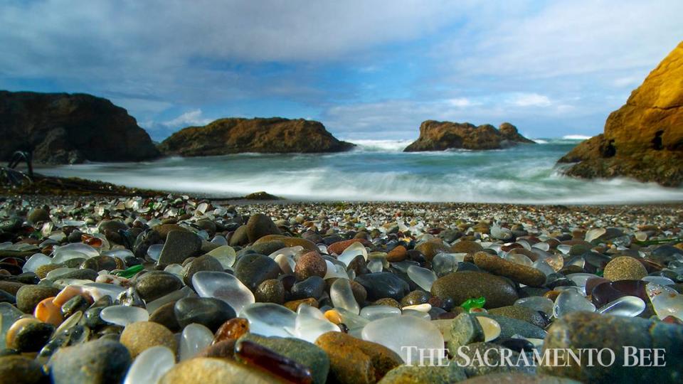 Residents once used to discard trash on Glass Beach in Fort Bragg and over time the action of the waves has worn smooth the shards of glass that littered the beach. The beach is now covered with smooth colorful pieces of glass.