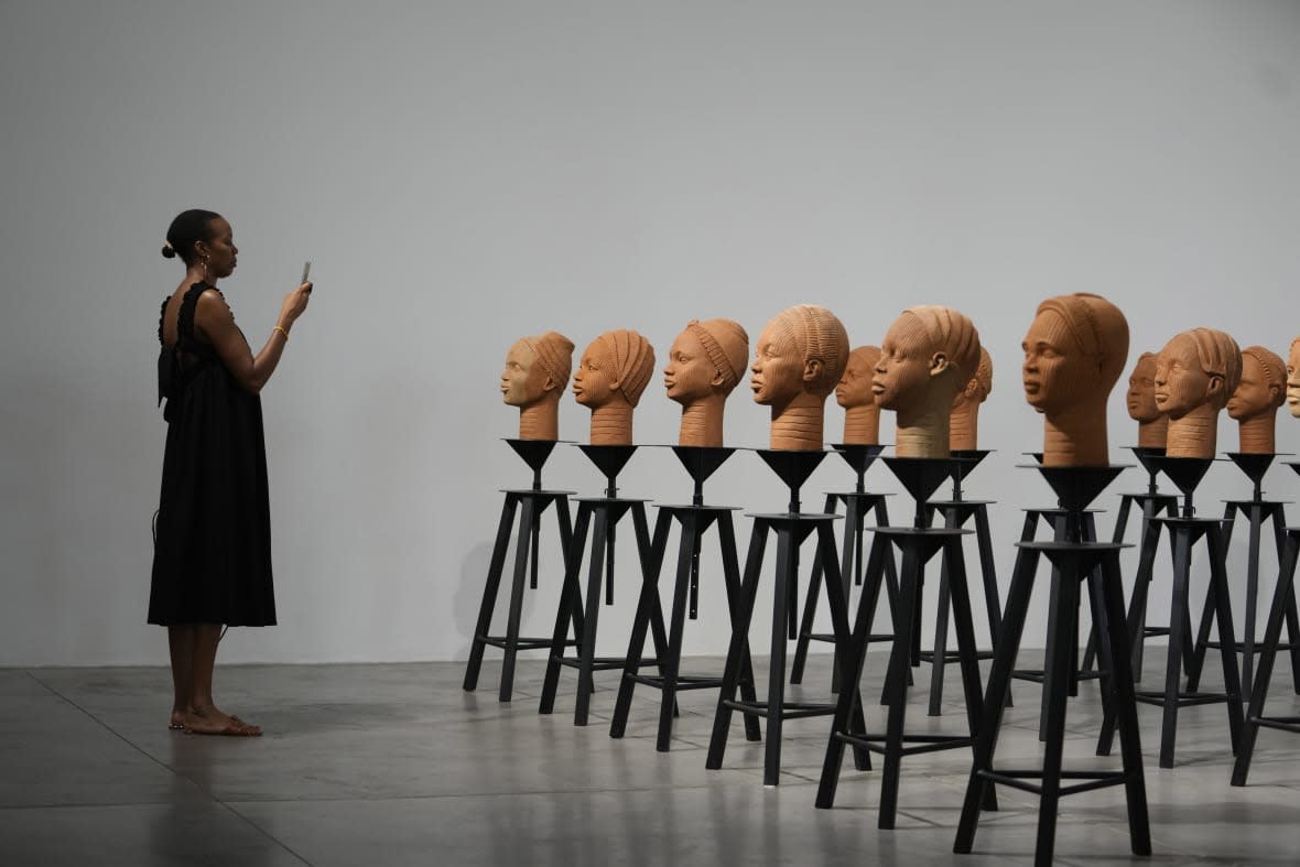 Sculptures created by French artist Prune Nourry, Inspired by ancient Nigerian Ife terracotta heads, titled “Statues Also Breathe,” and representing the remaining 108 Chibok still in captivity are displayed in Lagos, Nigeria, Tuesda(AP Photo/Sunday Alamba)