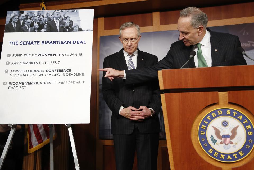 U.S. Senator Charles Schumer (D-NY) (R) and Senate Majority Leader Harry Reid (D-NV) appear at a news conference after bipartisan passage of stopgap budget and debt legislation at the U.S. Capitol in Washington, October 16, 2013. The U.S. Senate approved a deal on Wednesday to end a political crisis that partially shut down the federal government and brought the world's biggest economy to the edge of a debt default that could have threatened financial calamity. REUTERS/Jonathan Ernst