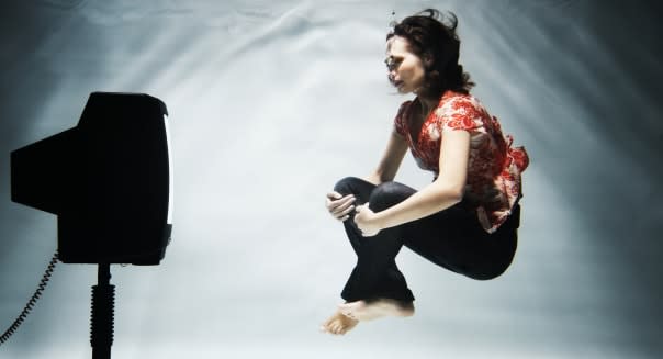 Woman watching TV under water