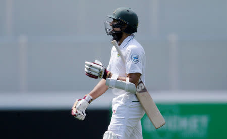 Cricket - Australia v South Africa - Third Test cricket match - Adelaide Oval, Adelaide, Australia - 24/11/16. South Africa's Hashim Amla walks off the pitch after being caught by Australia's Matt Renshaw in Adelaide. REUTERS/Jason Reed