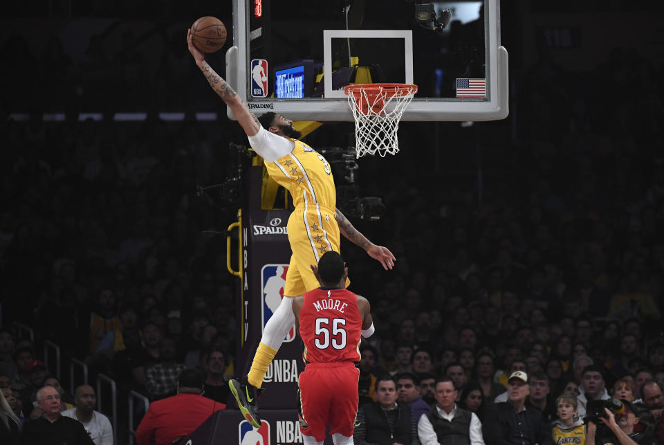 LOS ANGELES, CA - JANUARY 03: Anthony Davis #3 of the Los Angeles Lakers dunk against E'Twaun Moore #55 of the New Orleans Pelicans during the first half of the basketball game at Staples Center on January 3, 2020 in Los Angeles, California. NOTE TO USER: User expressly acknowledges and agrees that, by downloading and or using this Photograph, user is consenting to the terms and conditions of the Getty Images License Agreement. (Photo by Kevork Djansezian/Getty Images)