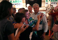 <p>Republican candidate Karen Handel takes a selfie with a supporter during a campaign stop at Houck’s Grille as she runs for Georgia’s 6th Congressional District on June 19, 2017 in Roswell, Ga. (Photo: Joe Raedle/Getty Images) </p>