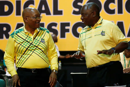 Deputy president of South Cyril Ramaphosa (R) chats with President of South Africa Jacob Zuma during the 54th National Conference of the ruling African National Congress (ANC) at the Nasrec Expo Centre in Johannesburg, South Africa December 16, 2017. REUTERS/Siphiwe Sibeko