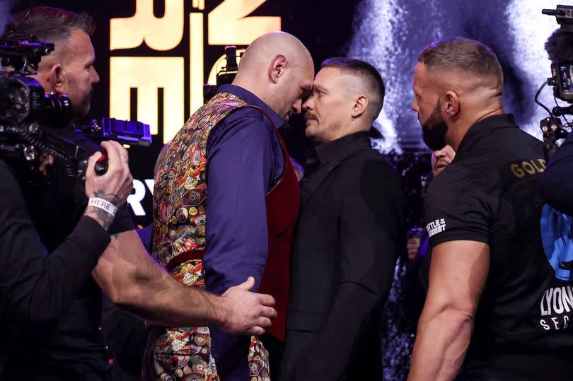 Britain's Tyson Fury (L) and Ukraine's Oleksandr Usyk (R) challenge each other during a press conference, in London, on November 16, 2023, ahead of their undisputed heavyweight world championship contest, taking place on February 17, 2024 in Riyadh, Saudi Arabia