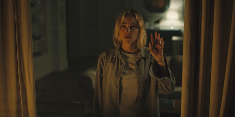 This image released by IFC Films shows Maika Monroe in a scene from "Watcher." (IFC Films via AP)