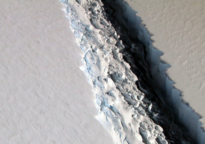 This Nov. 10, 2016 aerial photo released by NASA, shows a rift in the Antarctic Peninsula's Larsen C ice shelf. According to NASA, IceBridge scientists measured the Larsen C fracture to be about 70 miles long, more than 300 feet wide and about a third of a mile deep.