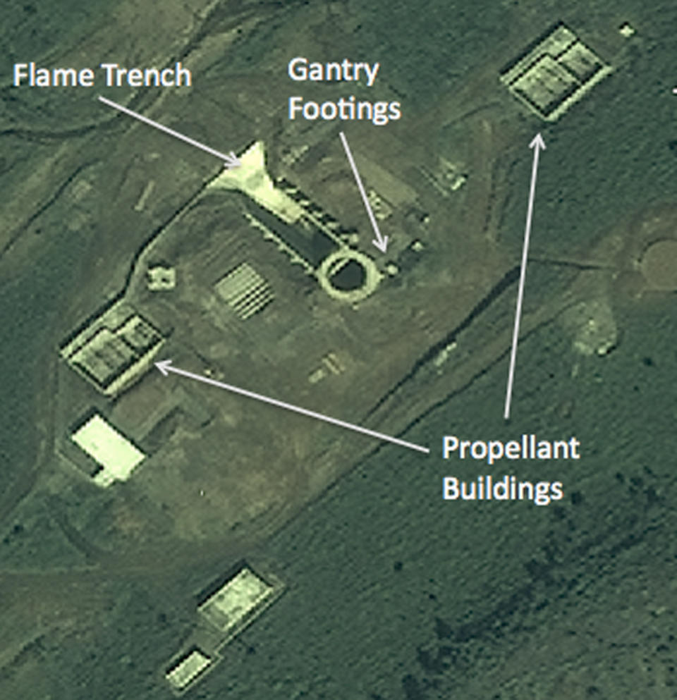 In this satellite image taken Aug. 29, 2012 by DigitalGlobe and provided Monday, Sept. 24, 2012 by 38 North, the website of the U.S.-Korea Institute at Johns Hopkins School of Advanced International Studies, structures which an analyst says gantry footings, a flame trench and propellant buildings of a new launch pad are seen at the Tonghae launch complex near the village of Musudan-ri on the northeast coast of North Korea. North Korea has stopped construction on the launch pad where intercontinental-range rockets could be tested, an interruption possibly due to heavy rains and that could stall completion up to two years, according to the analysis of Aug. 29 images provided to The Associated Press by 38 North. (AP Photo/DigitalGlobe) NO SALES, MANDATORY CREDIT