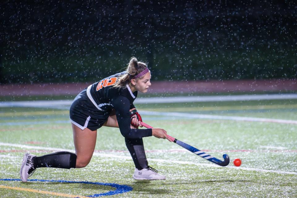 Uxbridge's Amelia Blood takes a stroke and scores against Wachusett during the CMADA Class A field hockey championship Monday at Foley Stadium.