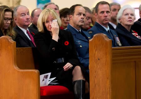 Laureen Harper, wife of Canadian Prime Minister Stephen Harper, cries while attending Cpl. Nathan Cirillo's regimental funeral service in Hamilton, Ontario October 28, 2014. REUTERS/Nathan Denette/Pool