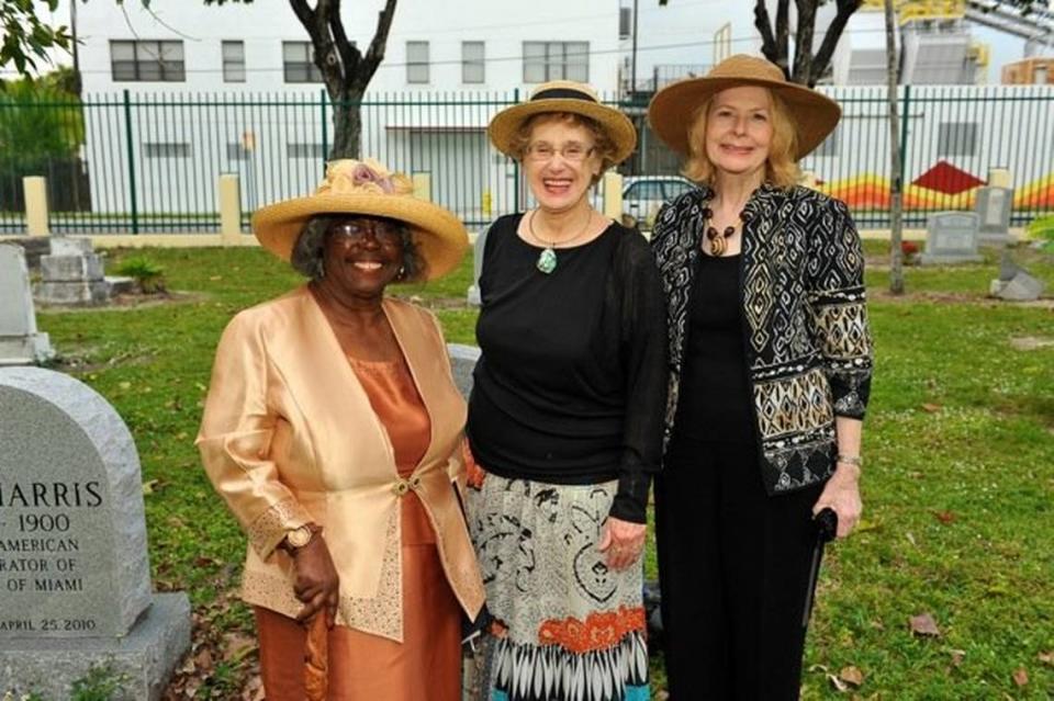 Enid Pinkney, left, and Penny Lambeth, center, at the 2014 Commemorative Service at the City of Miami Cemetery.