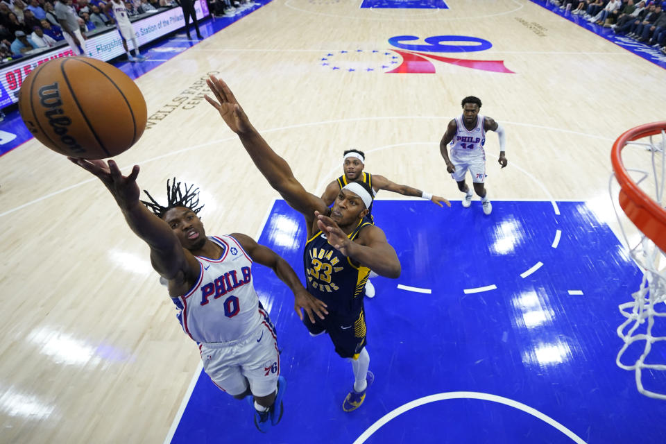 Philadelphia 76ers' Tyrese Maxey, left, goes up for a shot against Indiana Pacers' Myles Turner during the first half of an NBA basketball game, Sunday, Nov. 12, 2023, in Philadelphia. (AP Photo/Matt Slocum)