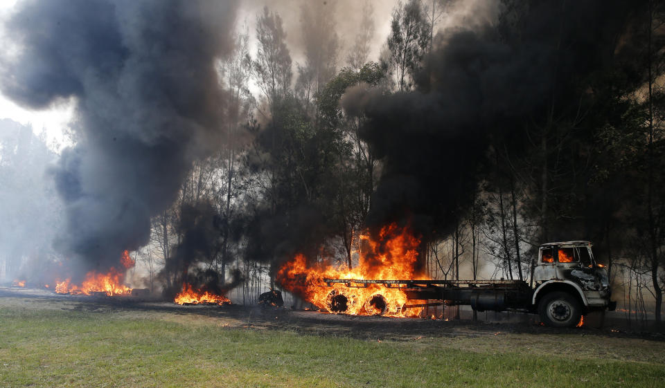 The photo shows a truck engulfed in flames at a property at Old Bar, NSW.