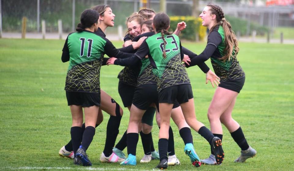 The Hilmar High girls soccer team celebrates after sophomore Brisa Gonzales (9) tied the NorCal Regional Division VI championship against Winters at 1-1 early in the second half on Saturday, March 2, 2024.