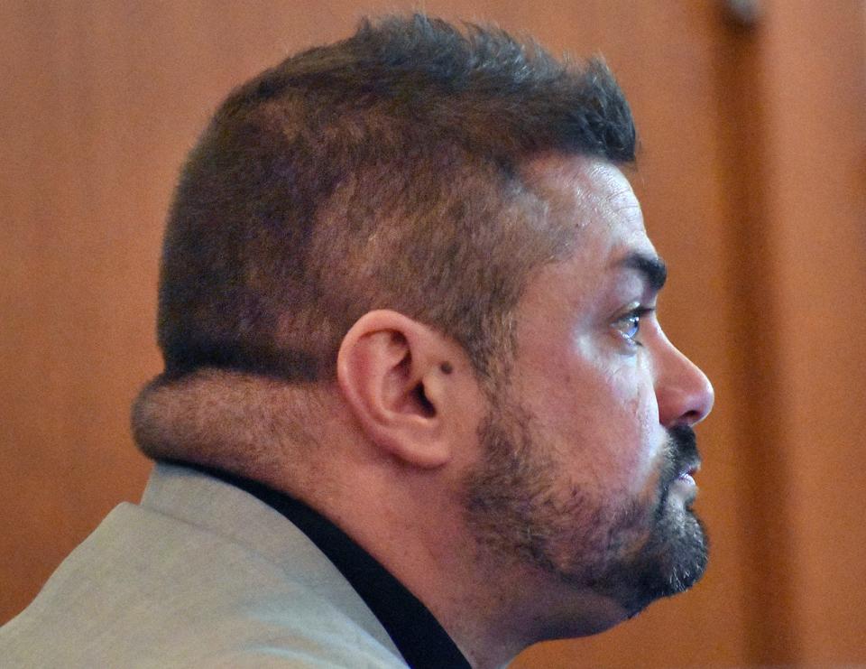 Former Fall River police officer Michael Pessoa listens to the proceedings of his trial in court on Tuesday, May 23.