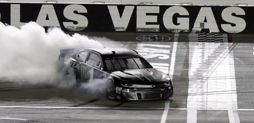 Kurt Busch performs a burnout after winning a NASCAR Cup Series auto race, Sunday, Sept. 27, 2020, in Las Vegas. (AP Photo/Isaac Brekken)