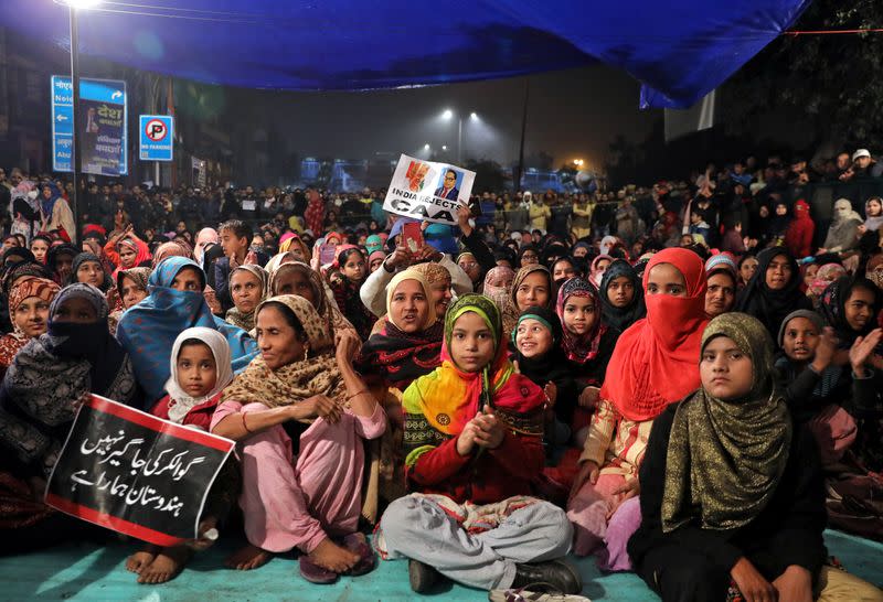 Local residents attend a protest against a new citizenship law, in New Delhi