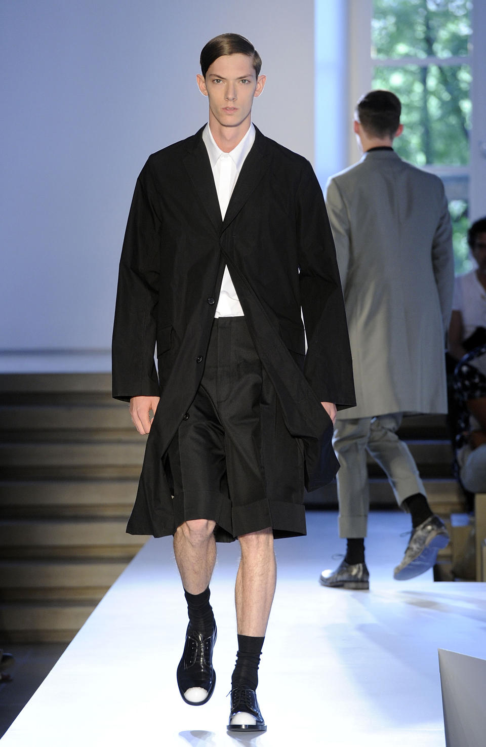 A model wears a creation of the Jil Sander men's Spring-Summer 2014 collection, part of the Milan Fashion Week, unveiled in Milan, Italy, Saturday, June 22, 2013. (AP Photo/Giuseppe Aresu)