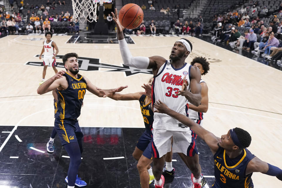 Mississippi forward Moussa Cisse (33) grabs a rebound over California guard Keonte Kennedy (3) during the second half of an NCAA college basketball game in San Antonio, Saturday, Dec. 16, 2023. (AP Photo/Eric Gay)