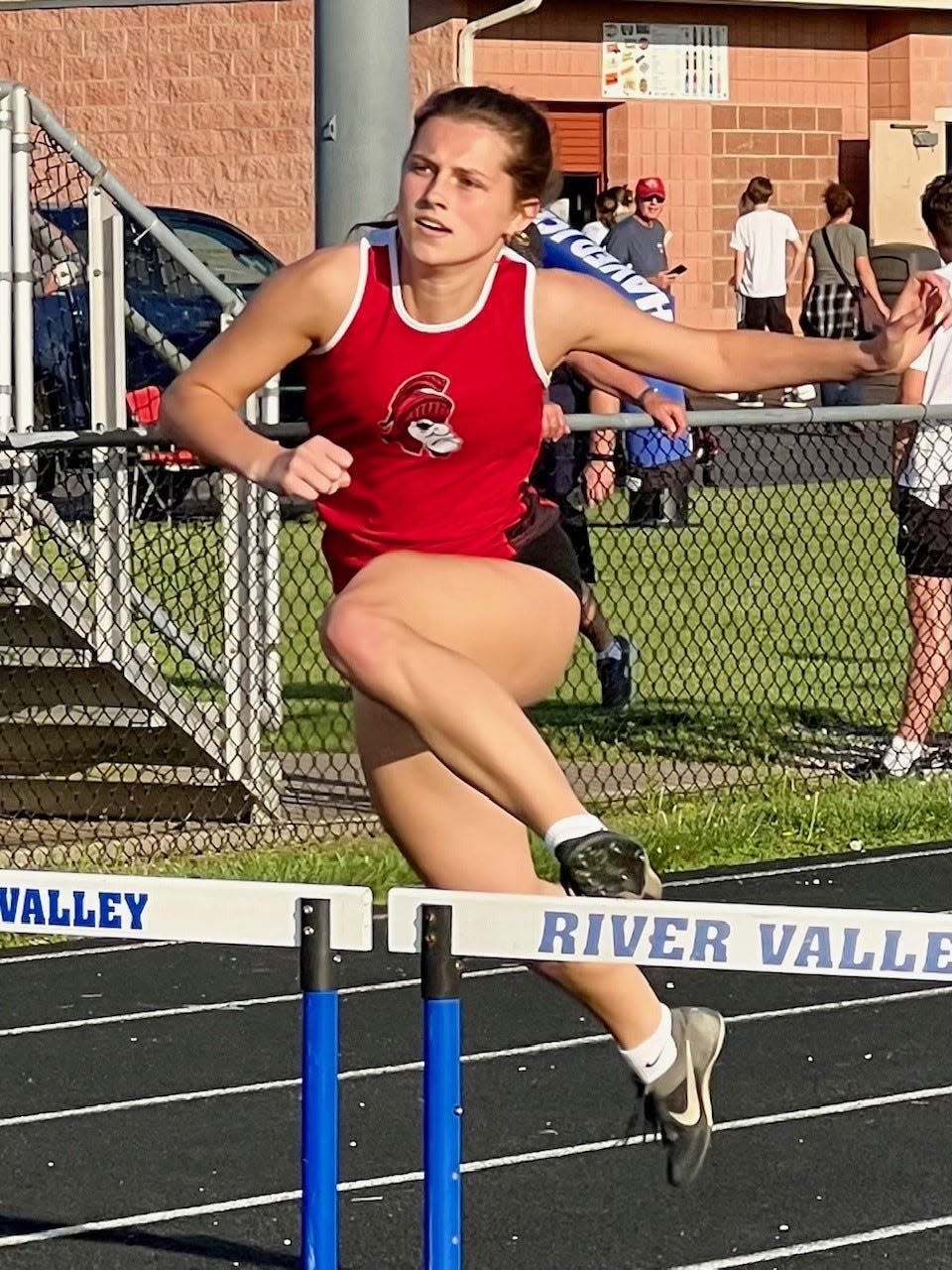 Pleasant's Taydon Obenour runs the 300-meter hurdles during Wednesday's Marino County Track Meet at River Valley.