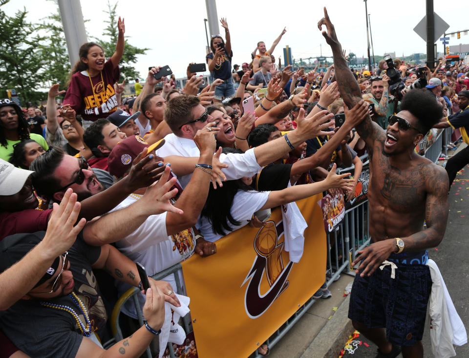 Cleveland Cavaliers Iman Shumpert celebrates with the crowd during a parade to celebrate winning the 2016 NBA Championship in downtown Cleveland, Ohio, U.S. June 22, 2016. REUTERS/Aaron Josefczyk