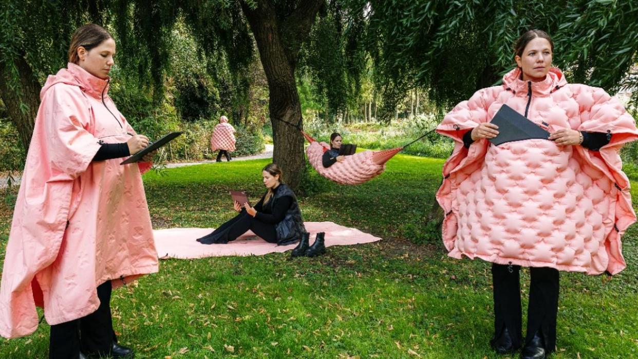  Multiple women outside wearing and using the Lenovo Tab Wear collection. 