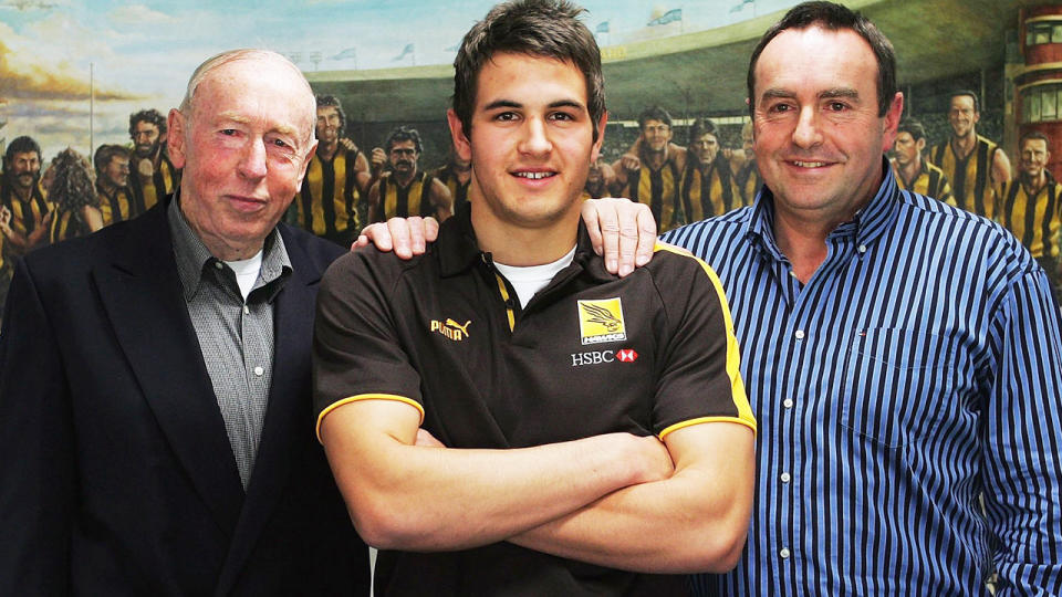 Pictured here, three generations of Kennedy's in Aussie Rules with John senior and junior on either side of Josh Kennedy.