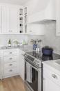 <p>A classic onyx backsplash and custom cabinetry complete an all-white modern chef's kitchen design by <a href="https://deringhall.com/interior-designers/jeanne-finnerty" rel="nofollow noopener" target="_blank" data-ylk="slk:Jeanne Finnerty;elm:context_link;itc:0;sec:content-canvas" class="link ">Jeanne Finnerty</a>.</p>