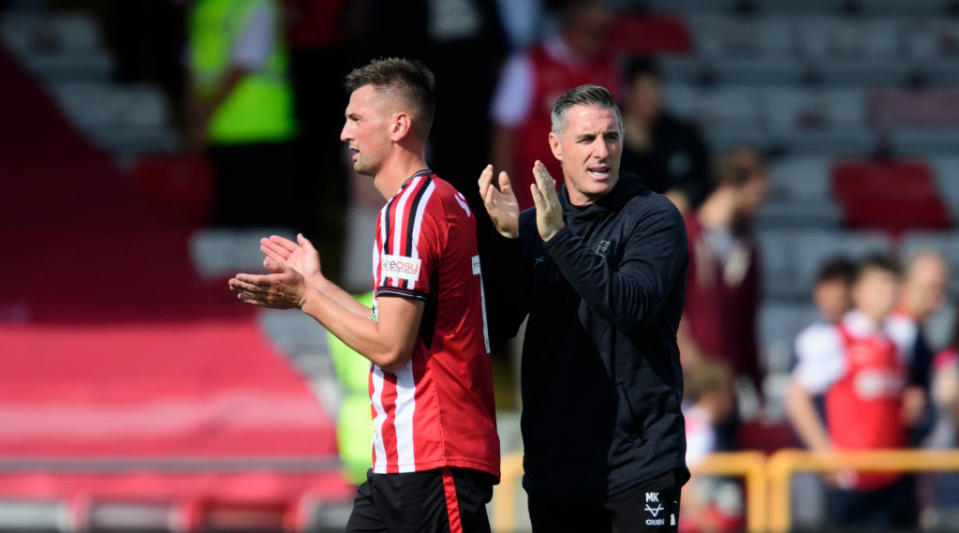 Lincoln City season preview 2023/24 Lincoln City's Paudie O'Connor, left, and Lincoln City head coach Mark Kennedy applaud the fans following the pre-season friendly match between Lincoln City and Rotherham United at the LNER Stadium on July 29, 2023 in Lincoln, England.