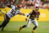 Washington Football Team running back Jaret Patters (35) gets away from Cincinnati Bengals defensive end Amani Bledsoe (93) during the second half of a preseason NFL football game Friday, Aug. 20, 2021, in Landover, Md. (AP Photo/Nick Wass)