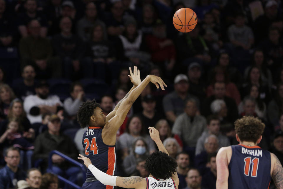 Pepperdine forward Maxwell Lewis, left, shoots while defended by Gonzaga guard Julian Strawther during the first half of an NCAA college basketball game, Saturday, Dec. 31, 2022, in Spokane, Wash. (AP Photo/Young Kwak)