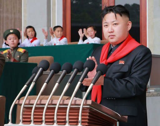 This photo released by North Korea's official Korean Central News Agency (KCNA) on June 7 shows North Korean leader Kim Jong-Un (C) making a speech on June 6. South Korea accused North Korea of "crossing the line" with its recent threats and insults, and pressed the impoverished country to start repayments for past food aid