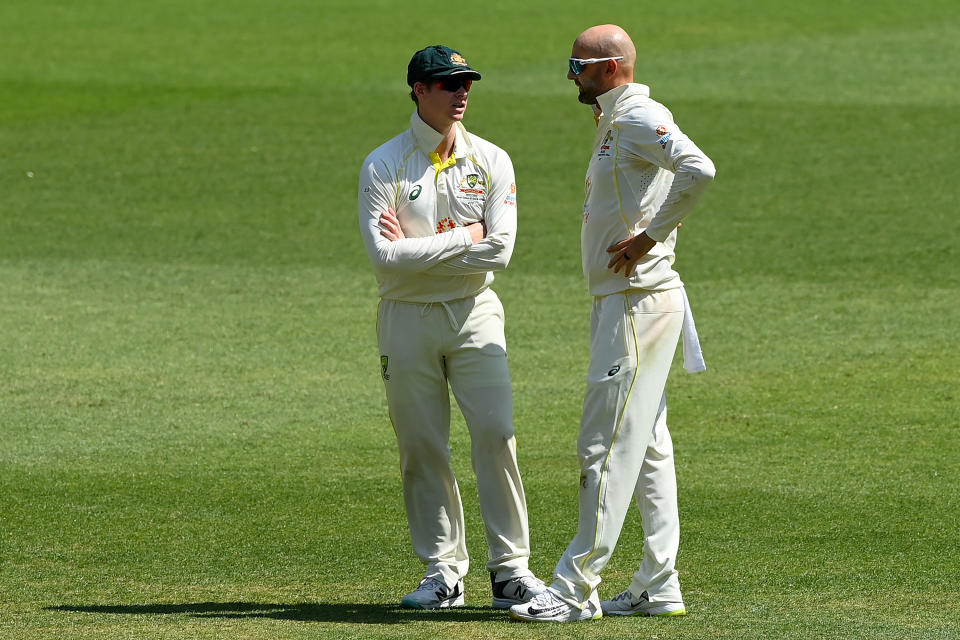 Seen here, Aussie pair Steve Smith and Nathan Lyon chatting to each other during the first Test against the West Indies in Perth. 