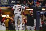 Arizona Diamondbacks' Sergio Alcantara is congratulated after hitting a two-run home run during the seventh inning of a baseball game against the Milwaukee Brewers Monday, Oct. 3, 2022, in Milwaukee. (AP Photo/Morry Gash)