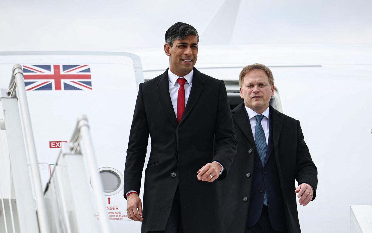 Rishi Sunak and Grant Shapps are pictured this morning arriving in Warsaw, Poland