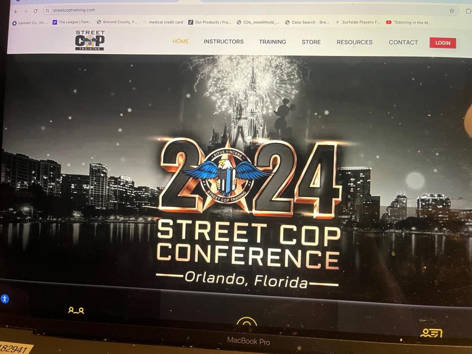 Photo taken of a computer showing the announcement for the Street Cop Training being held in Orlando.