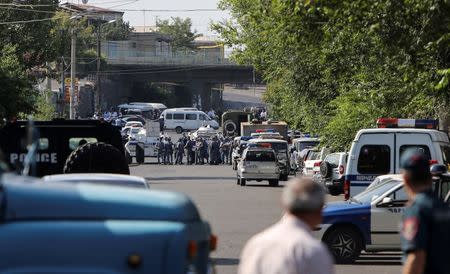 Policemen block a street after group of armed men seized a police station along with an unknown number of hostages, according the country's security service, in Yerevan, Armenia, July 17, 2016. REUTERS/Vahram Baghdasaryan/Photolure