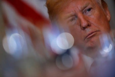 U.S. President Donald Trump attends a dinner with governors on border security and safe communities at the Blue room of the White House in Washington, U.S.,  May 21, 2018. REUTERS/Carlos Barria