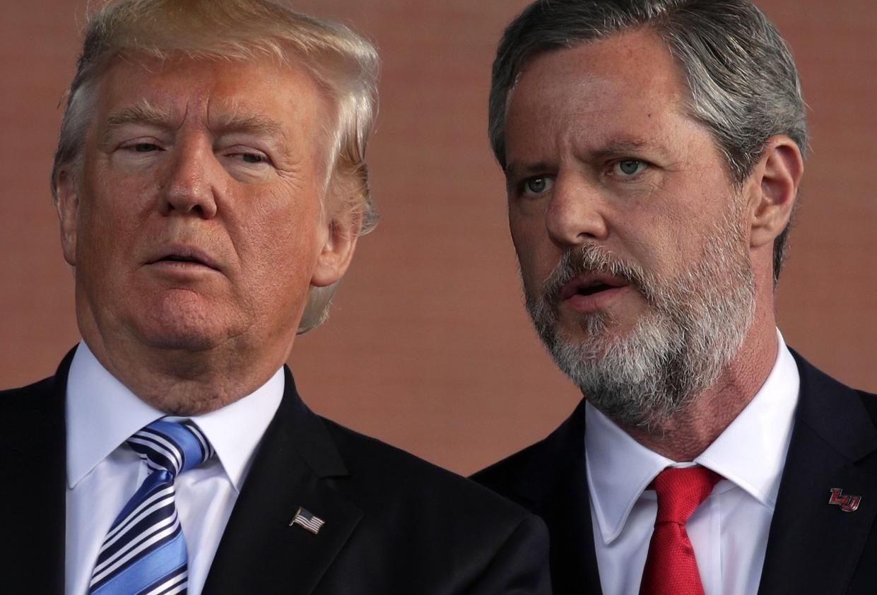 <p>U.S. President Donald Trump (L) and Jerry Falwell (R), President of Liberty University, on stage during a commencement at Liberty University May 13, 2017 in Lynchburg, Virginia</p> (Photo by Alex Wong/Getty Images)