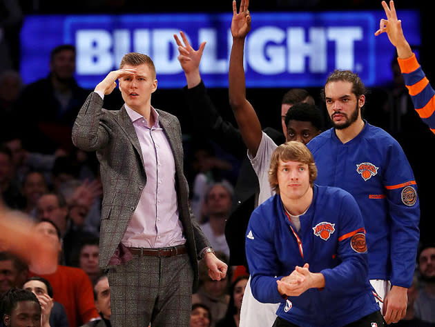 Kristaps Porzingis and the view from the bench. (Getty Images)