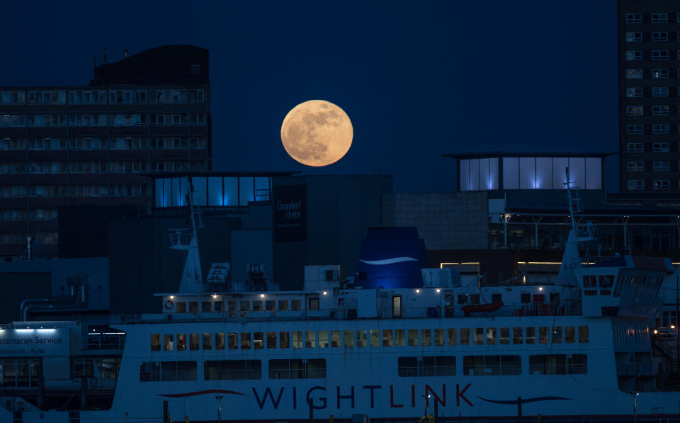 PORTSMOUTH, UNITED KINGDOM - JANUARY 31:  A Super Blue Blood Moon rises above Portsmouth on January 31, 2018 in Portsmouth, United Kingdom. A Super Blue Blood Moon is the result of three lunar phenomena happening all at once: not only is it the second full moon in January, but the moon will also be close to its nearest point to Earth on its orbit, and be totally eclipsed by the Earth's shadow. The last time these events coincided was in 1866, 152 years ago  (Photo by Matt Cardy/Getty Images)